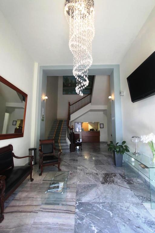 Historic lobby and staircase at Hotel Plaza Querétaro